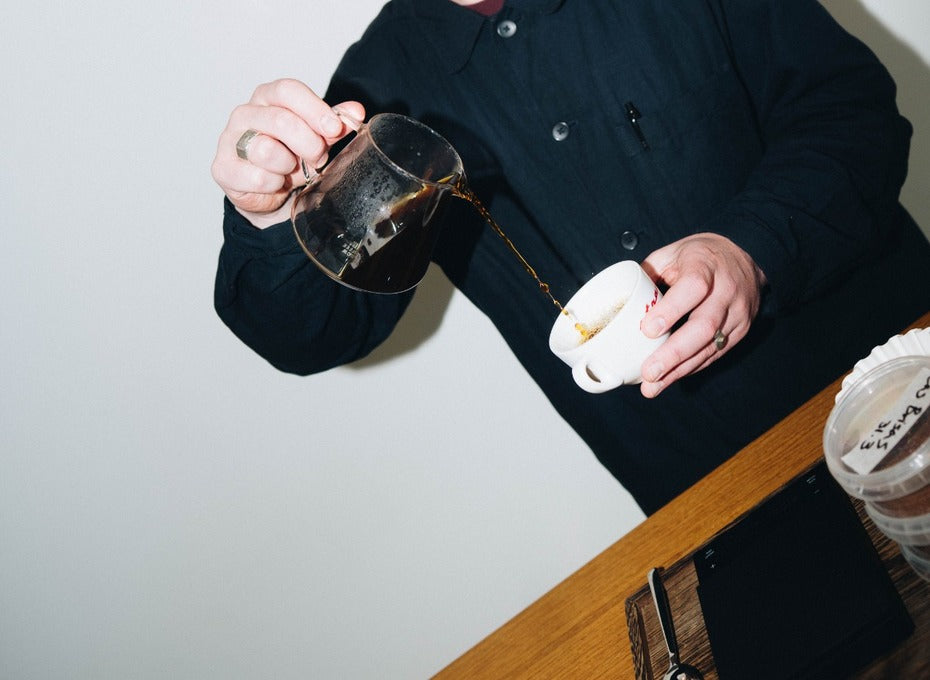 Coffee pouring from a server into a cup at SENSEI